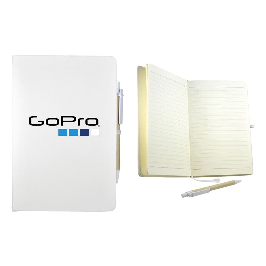 A white recycled notebook with a pen, featuring a logo, showing lined pages inside.