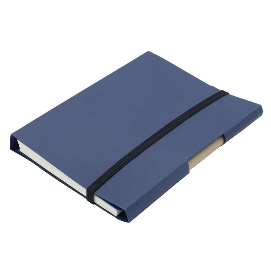 A navy blue tuck journal book with an elastic band closure and a pocket for notes. It has a simple design and branding.
