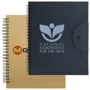 A navy notebook with a logo and a beige notebook, both featuring spiral bindings and a button closure.