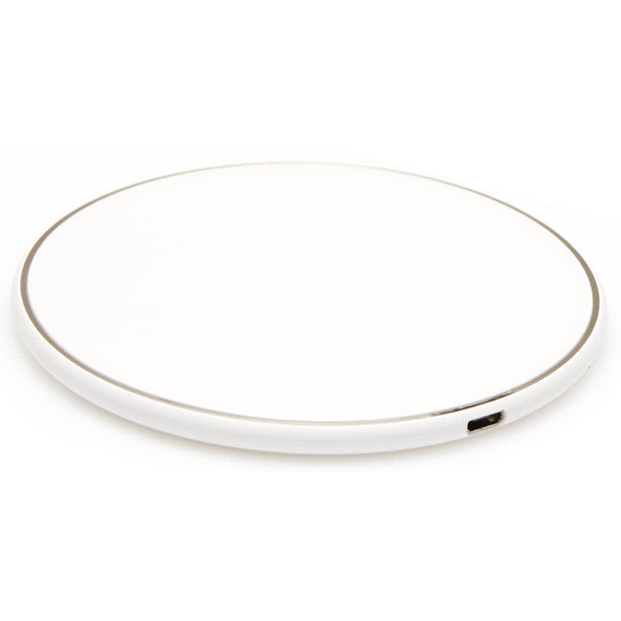 A round wireless charging dock in white with a subtle silver edge. Includes a USB port for charging.