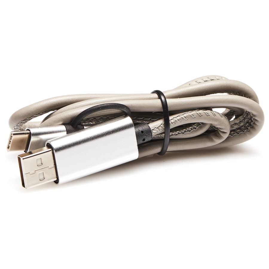 A grey charging cable featuring connectors on both ends, bundled with a black tie. It has a metallic silver casing.