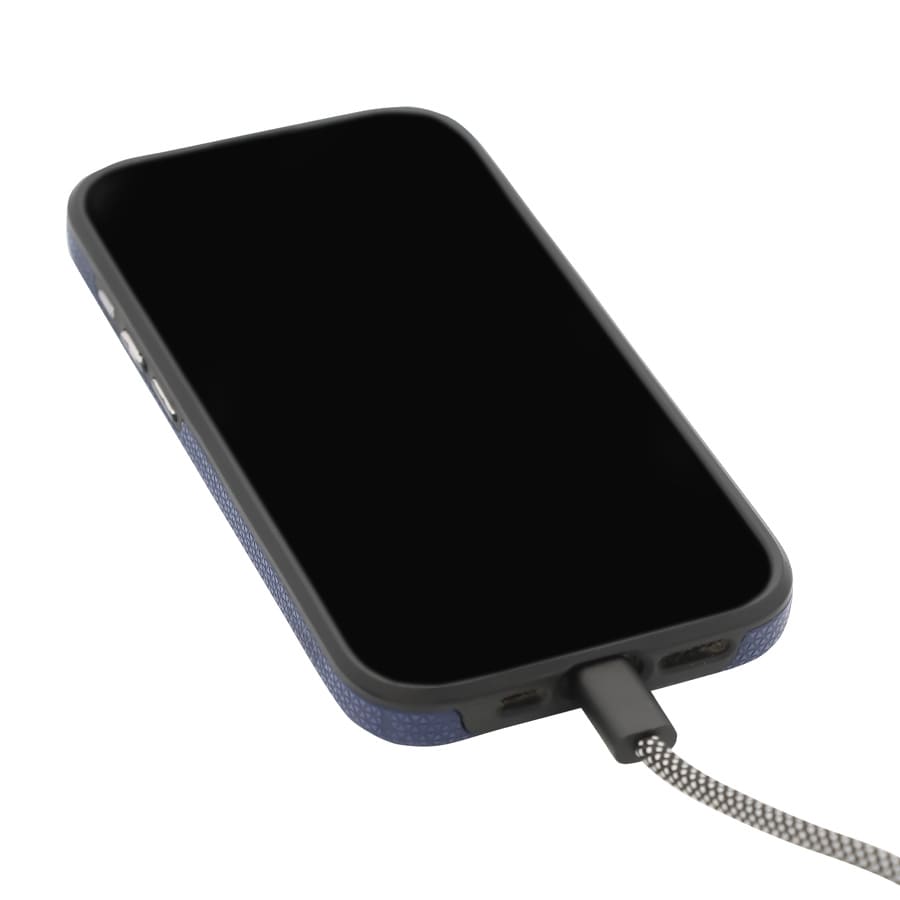 A black smartphone with a textured case and a grey charging cable connected.