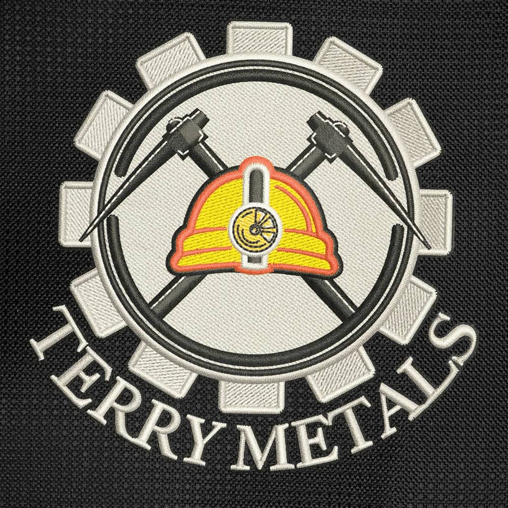 A logo featuring a hard hat crossed with hammers, surrounded by a gear design and the text 