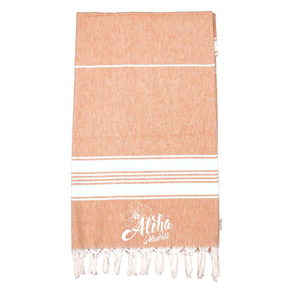 A 100% cotton Turkish towel in a warm orange hue with white stripes and frayed edges, featuring a logo.