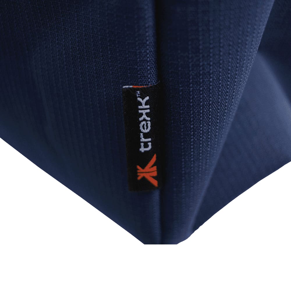 A navy waterproof beach bag with rope handles and zippered pockets. Features branding.