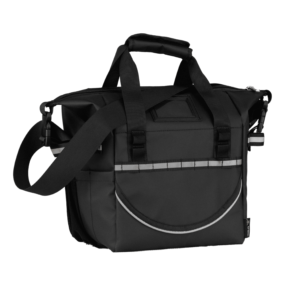 A cooler bag in black with strap and handles, featuring a logo, held by a person near a grey backdrop.