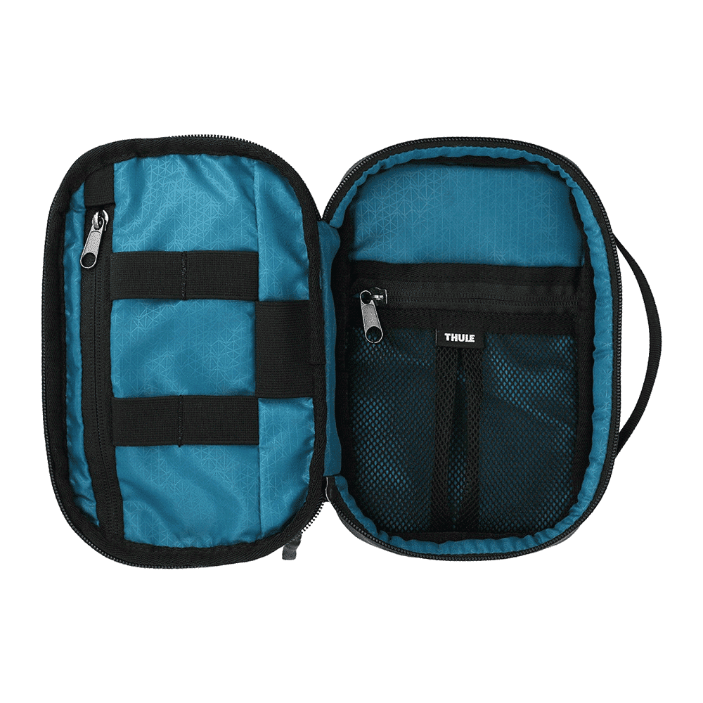 A toiletry bag featuring a teal interior, black zippers, and storage compartments. It has a brand logo inside.
