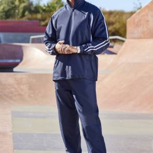 A pair of navy unisex track pants features a sporty design with contrasting stripes and a logo.