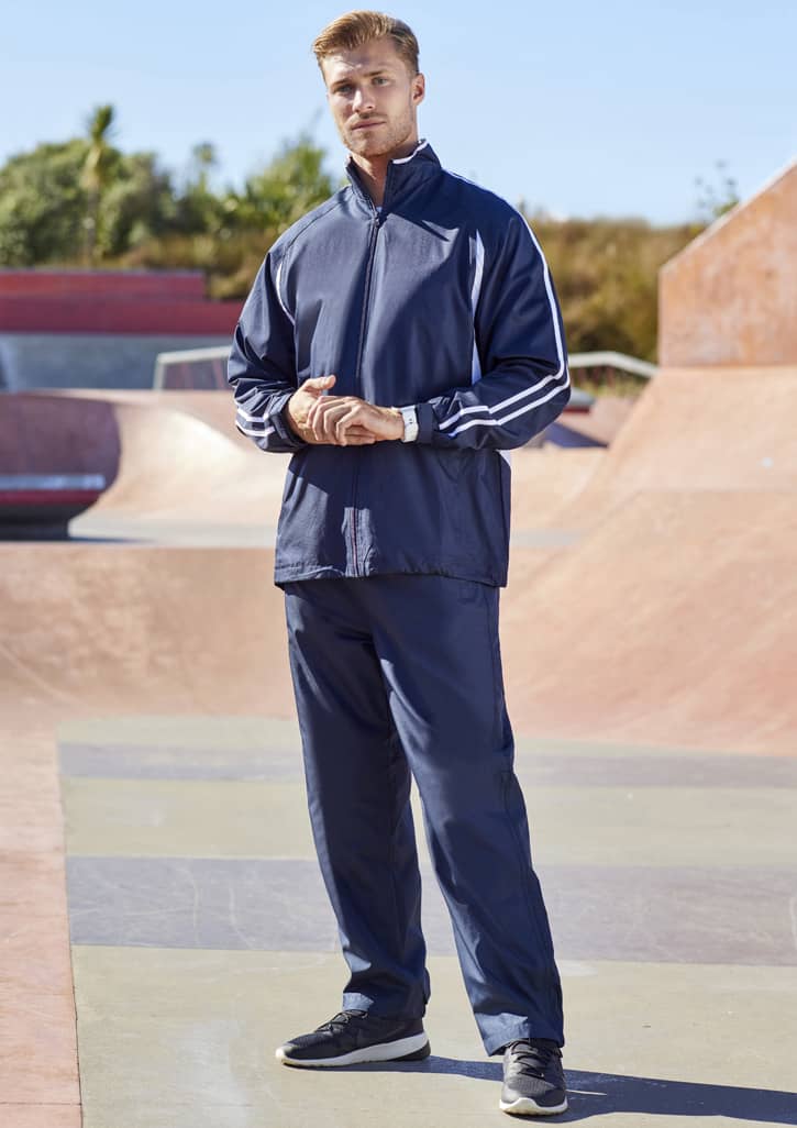 A pair of navy unisex track pants features a sporty design with contrasting stripes and a logo.