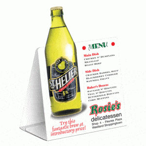 A table tent featuring a menu with a yellow drink bottle and a list of dishes in white and green.