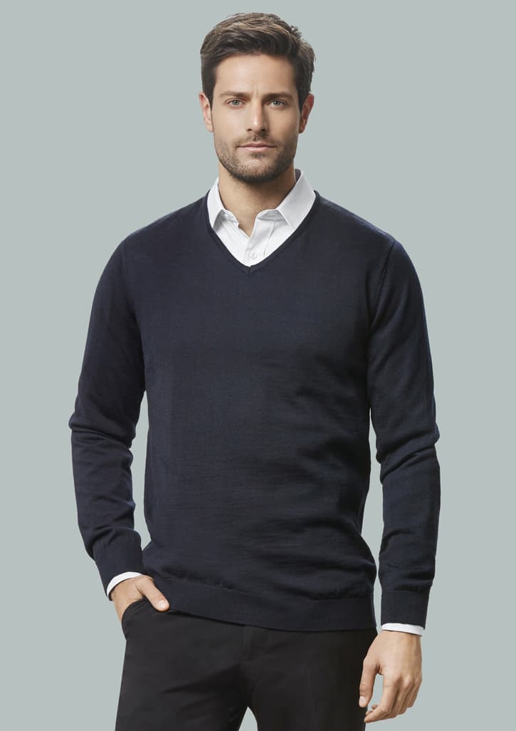 A dark navy v-neck pullover sweater worn over a collared shirt, featuring long sleeves and a fitted design.