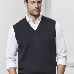 A navy men's woolmix knit vest with a V-neck design, worn over a white shirt. The model stands against a neutral background.