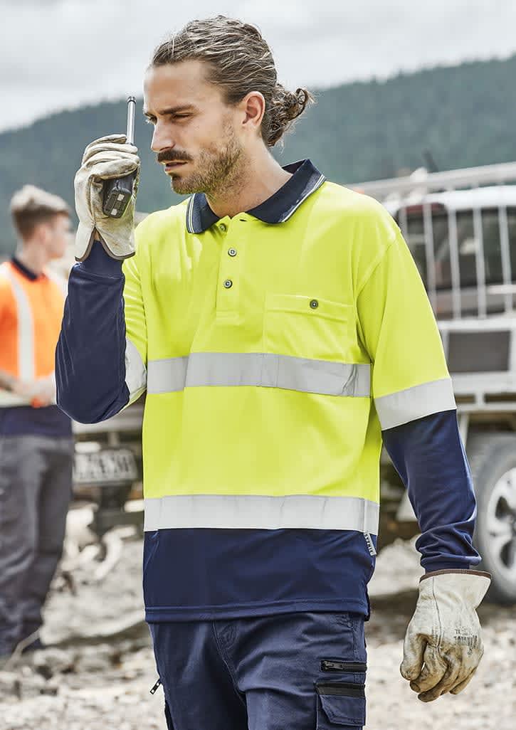 A men's high visibility long sleeve polo in bright yellow and navy, featuring reflective hoop tape and a pocket.
