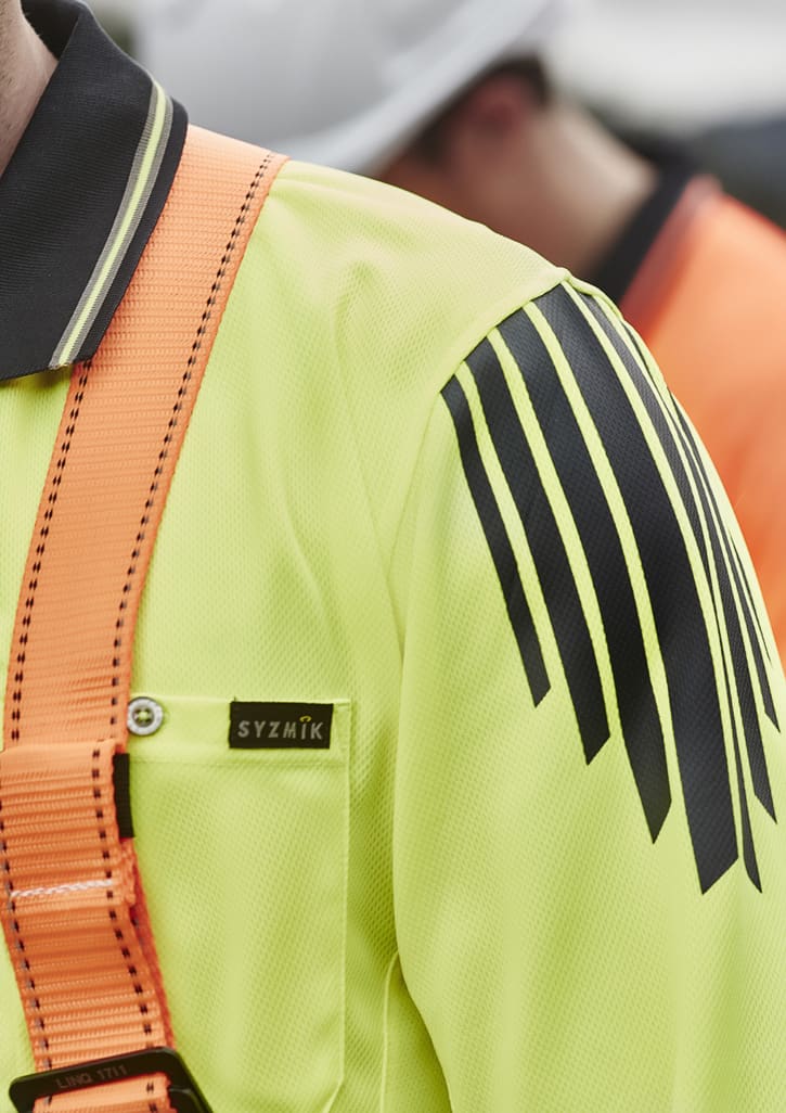 A long sleeve polo in bright yellow with black accents and a branded logo, designed for high visibility safety wear.