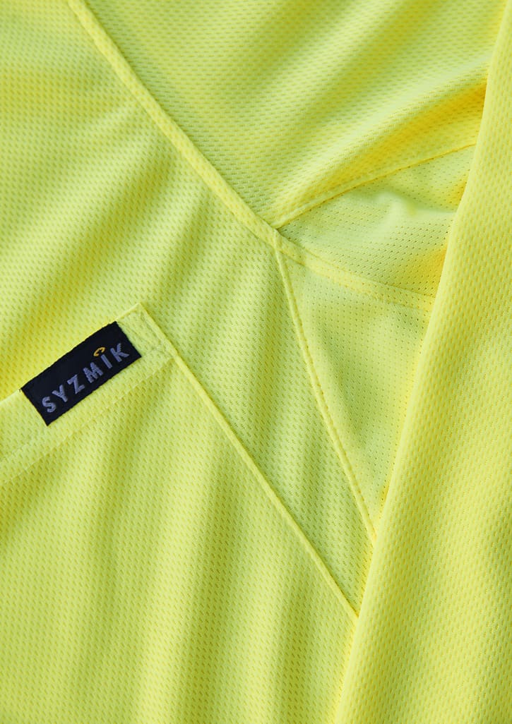A close-up of a men's long sleeve polo in bright yellow, featuring a logo on the fabric.