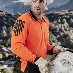 An orange and black long sleeve polo shirt featuring a logo, worn by a man carrying a bucket outdoors.