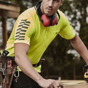Men's short sleeve polo shirt in bright yellow with reflective stripes, featuring a logo and worn by a man at a worksite.