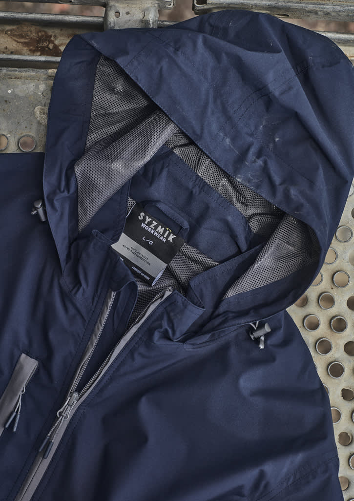 A navy unisex packable rain jacket featuring a hood, mesh lining, and a label. It includes a branding logo.