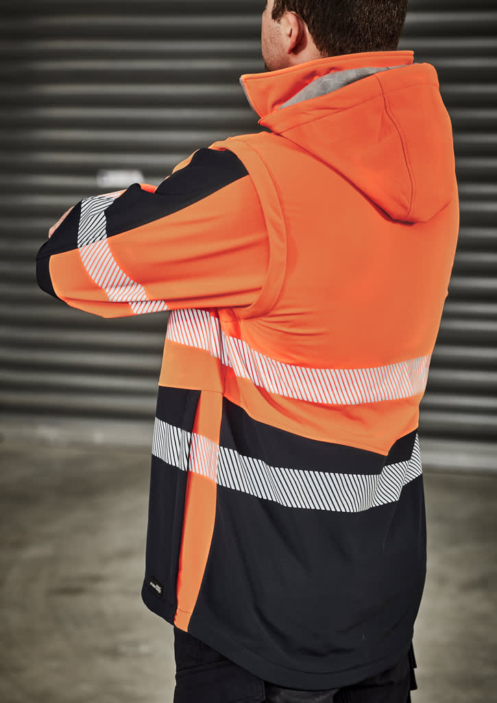 A unisex softshell jacket featuring bright orange and black colours, with reflective stripes and a hood.