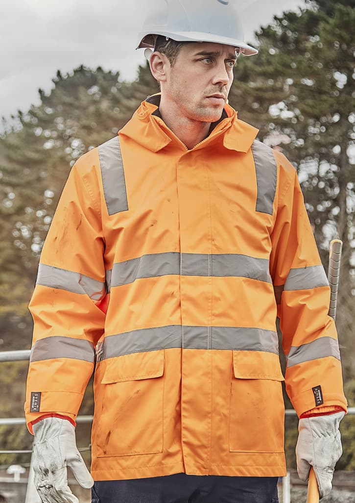 A waterproof unisex jacket in bright orange with reflective strips, designed for workwear, featuring a logo.