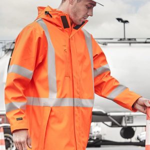 A heavy-duty waterproof jacket in bright orange with reflective stripes, worn by a person wearing a safety helmet.