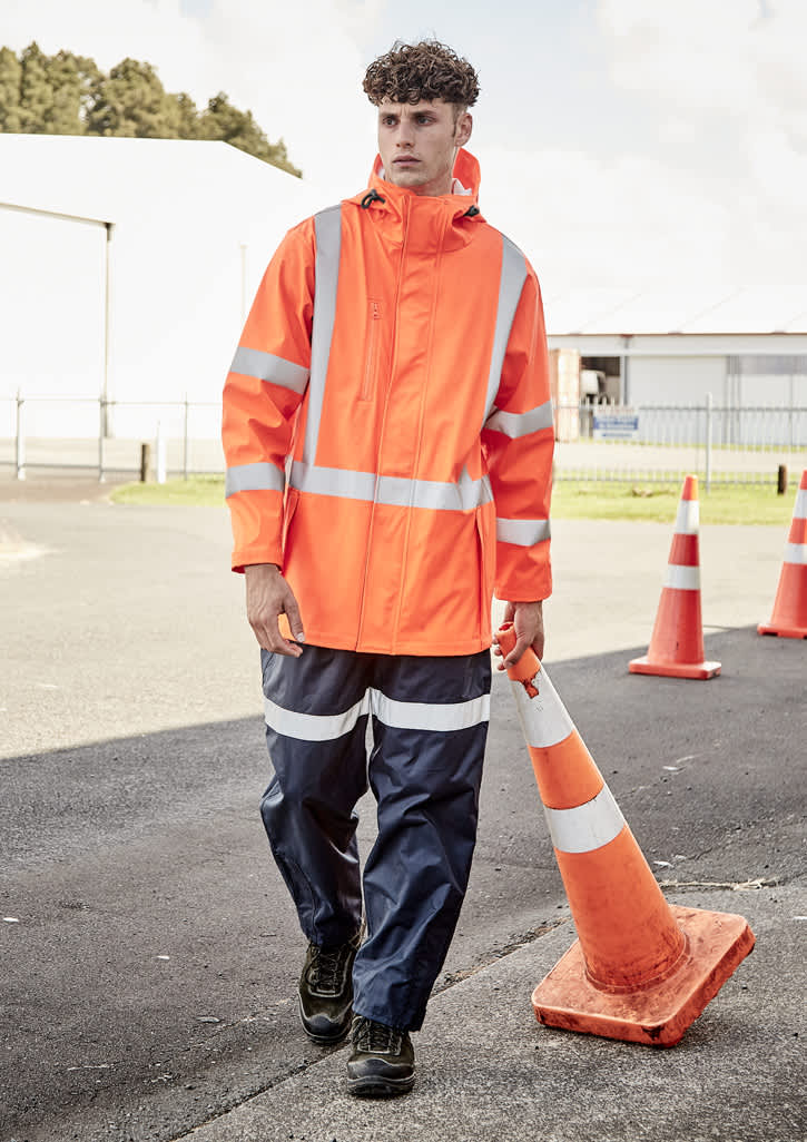 A heavy-duty waterproof jacket in fluorescent orange with reflective strips, worn by a model in blue work pants.