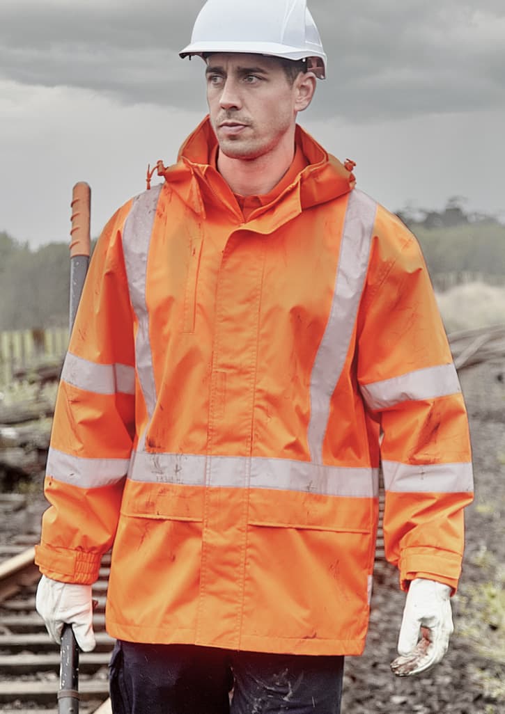 An orange waterproof jacket with reflective stripes, worn by a man in a hard hat and gloves, set against a cloudy background.