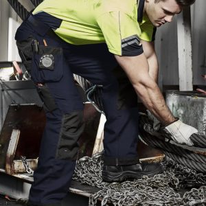 Men's ultralite multi-pocket pants in navy with multiple pockets, worn by a man in a high-visibility shirt.