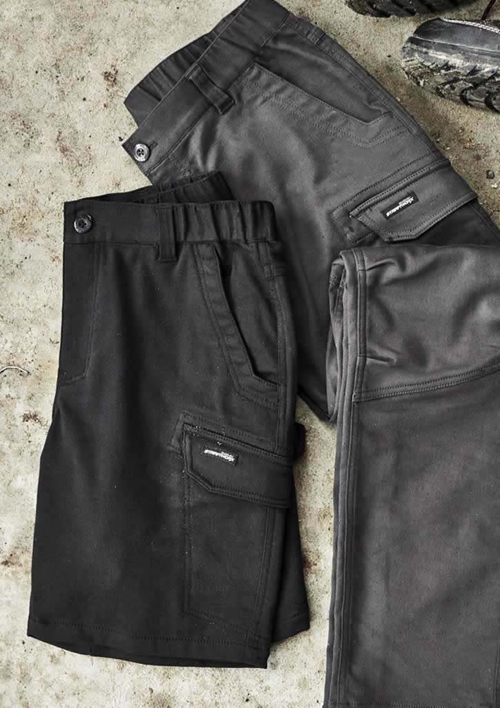 A pair of men's work shorts in black and grey, featuring pockets and a logo. The fabric has a sturdy texture.