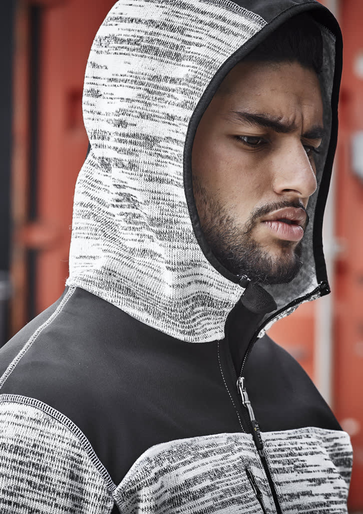A unisex reinforced knit hoodie in black and grey, featuring a hood and a zip closure, displayed on a model.