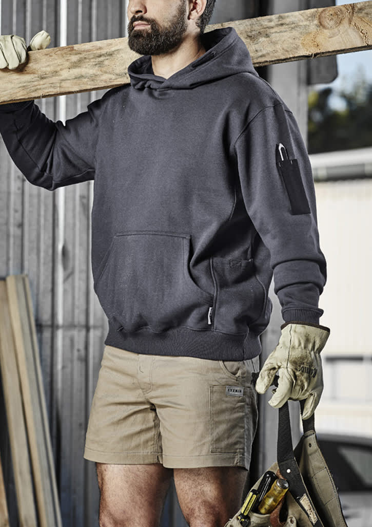 A dark grey unisex multi-pocket hoodie, worn by a person holding a wooden beam, featuring an attached logo.