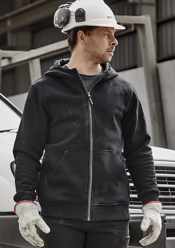 A black unisex zip front hoodie with multiple pockets, worn by a man in a hard hat and gloves, standing near a vehicle.