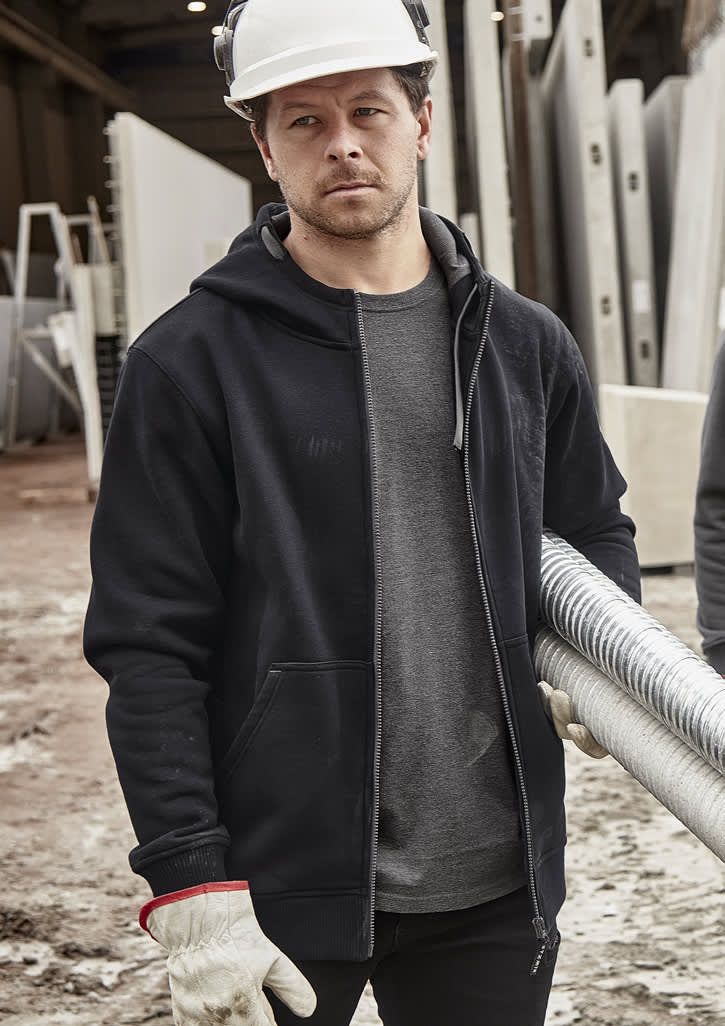 A black unisex zip front multi-pocket hoodie displayed on a person wearing gloves and a hard hat in a work environment.
