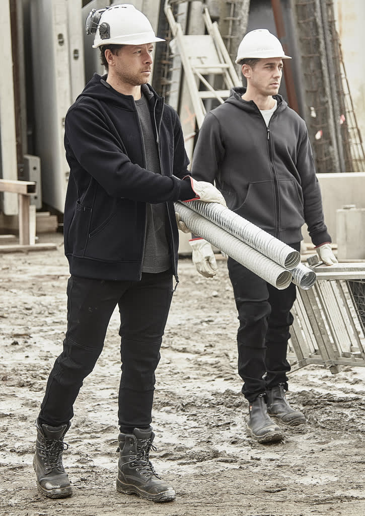 Unisex zip front multi-pocket hoodie in black, worn by two men on a construction site, carrying pipes. Both wear hard hats.