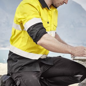 Men's long sleeve shirt in yellow with reflective tape, featuring a black bottom section. Logo present on the shirt.