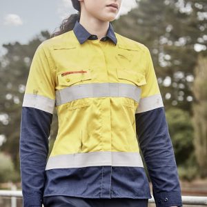 A lightweight women's shirt in orange and navy, featuring reflective taping and a logo. Suitable for workwear.