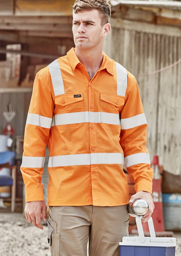 An orange long sleeve shirt with reflective stripes and a logo, worn by a man holding a drink bottle.