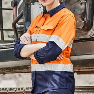 A long sleeve women's work shirt in high visibility orange and navy, featuring reflective tape and a logo.