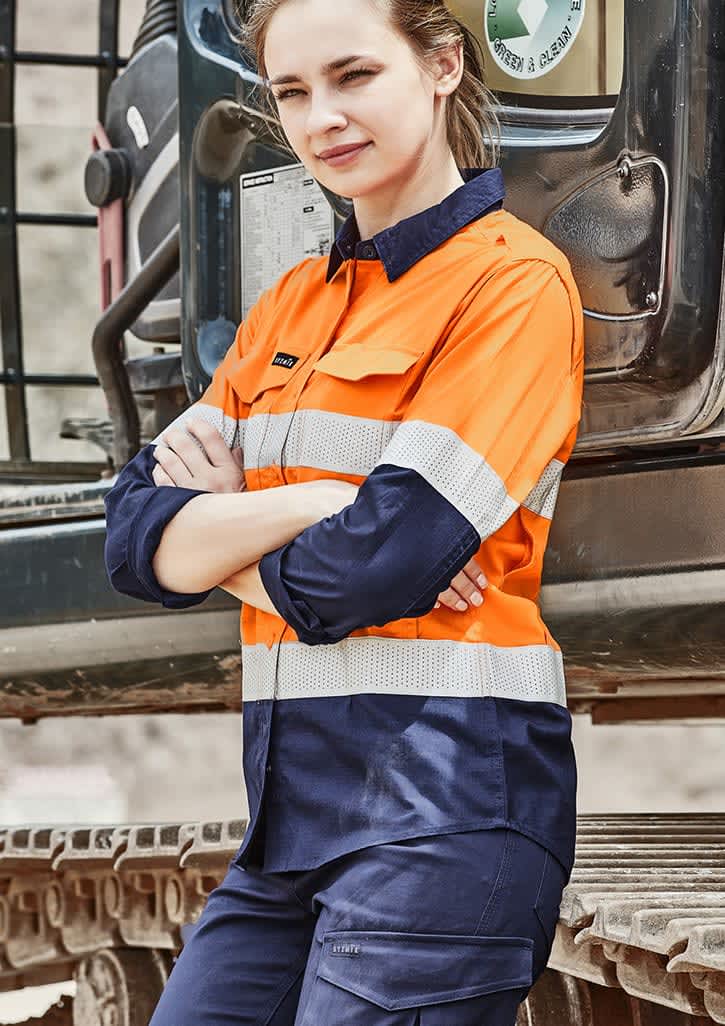 A long sleeve women's work shirt in high visibility orange and navy, featuring reflective tape and a logo.