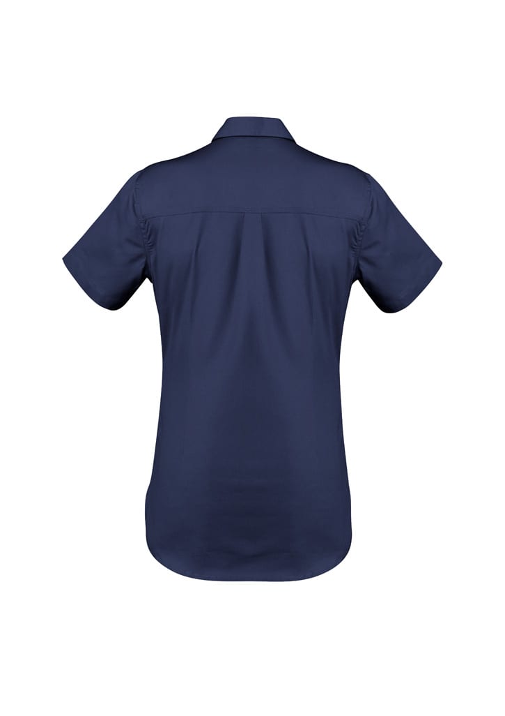 A lightweight women's short sleeve shirt in a neutral beige colour, featuring a back yoke and a logo.