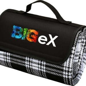 A black and white checkered picnic rug with a handle and a logo on the front.