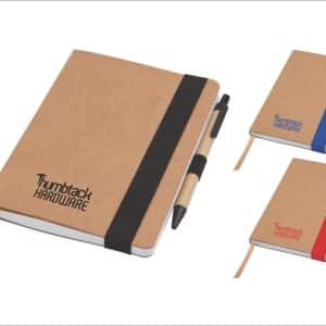 A set of three notepads with kraft covers, featuring black, blue, and red accents, each accompanied by a matching pen.