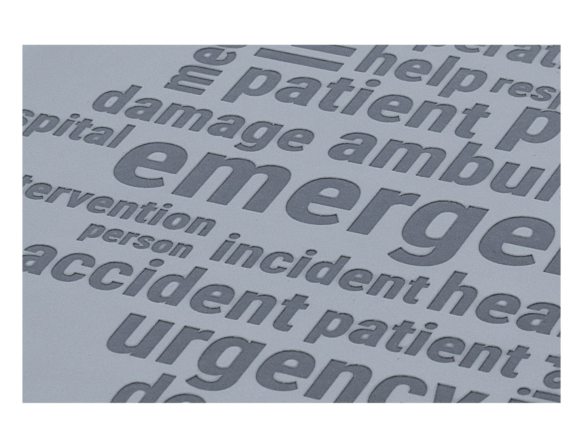A textured grey notebook featuring debossed keywords related to emergency services and healthcare, with a logo.