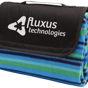 A folded picnic rug featuring blue, green, and black stripes with a branding logo.