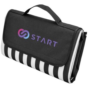 A black and white striped picnic rug featuring a carry handle and a logo on the front.