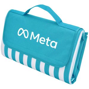 A picnic rug in aqua blue with white stripes, featuring a logo on the front and a carry handle.