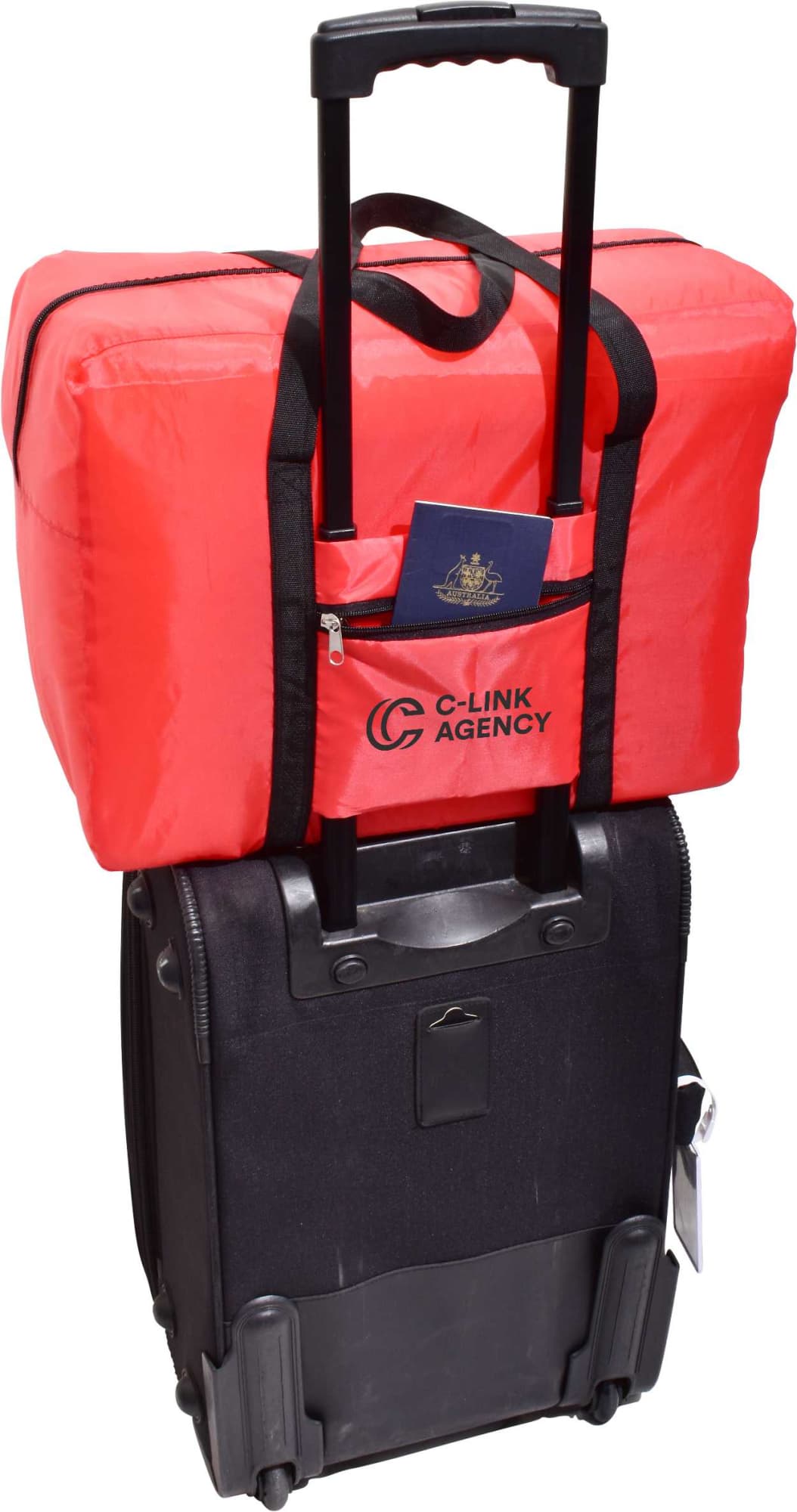 A red insulated bag sits atop a black wheeled suitcase, with a passport visible in the front pocket.