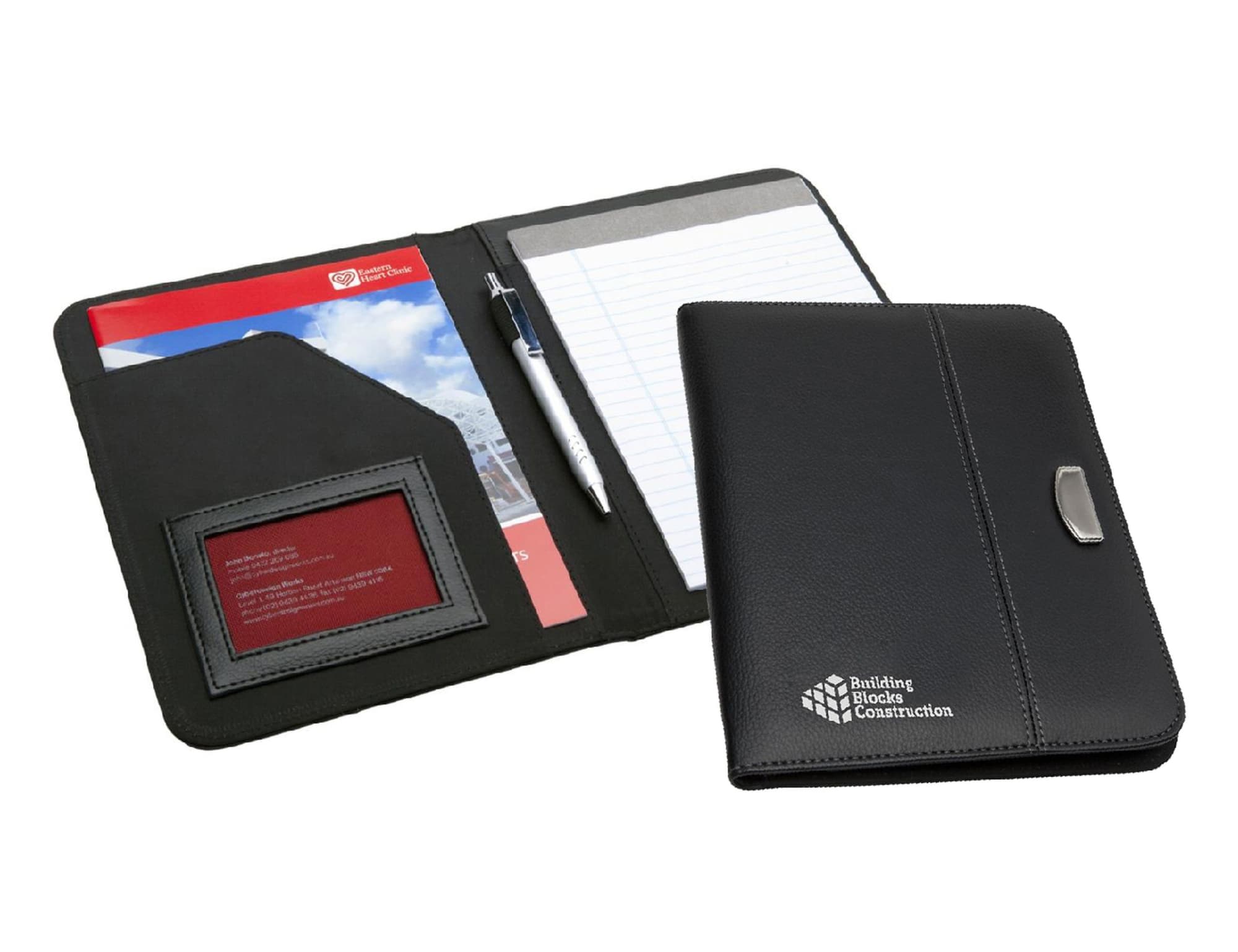 A black Meridian A5 portfolio with a pen, notepad, and cardholder displayed inside. Features a logo on the front.