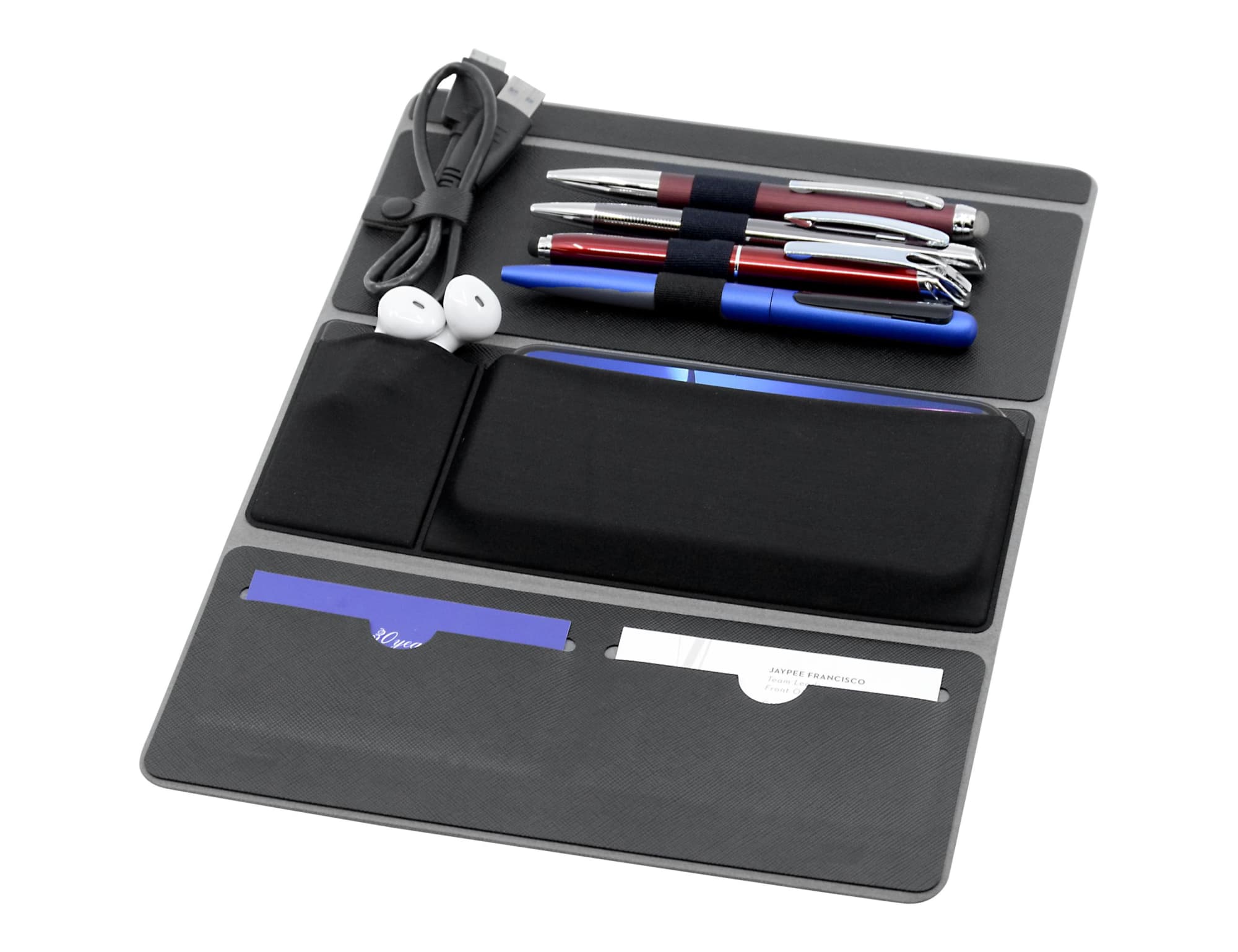 A black remote work A4 portfolio featuring pens, a USB cable, earphones, and pockets for notes and cards.