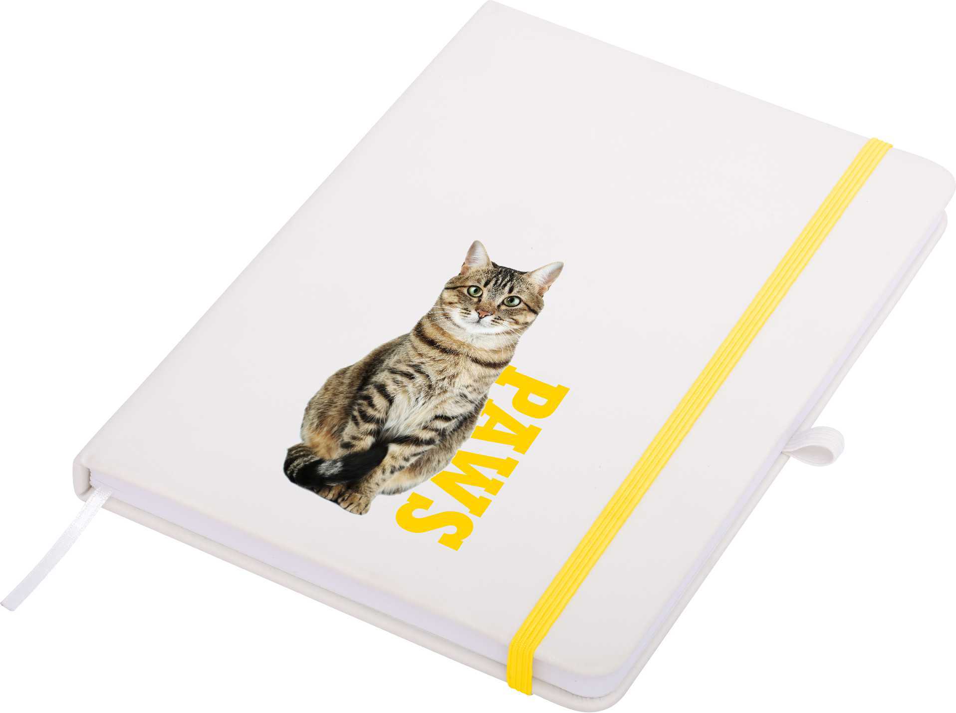A white A5 notepad with a yellow elastic band, featuring a cat graphic and the word 